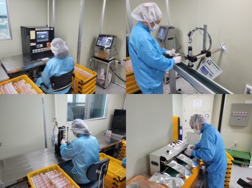 Production team employees are producing the bio kit through a meticulous inspection process.